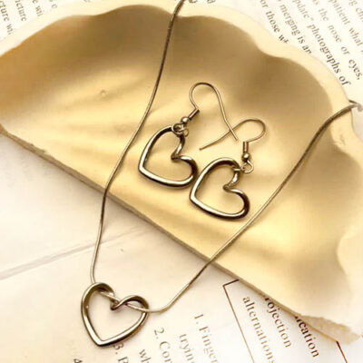 نیم ست استیل قلب دفرمه بازنجیر ماری